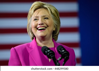 CHARLOTTE, NC, USA - JULY 5, 2016: Hillary Clinton smiling in magenta suit speaks at a rally at the Charlotte Convention Center in a joint appearance with the US President Barack Obama.