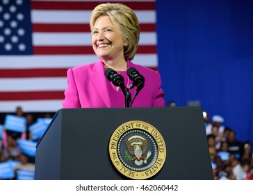 CHARLOTTE, NC, USA - JULY 5, 2016: Hillary Clinton Speaks From The Podium With The Presidential Seal At A Campaign Event With US President Barack Obama.