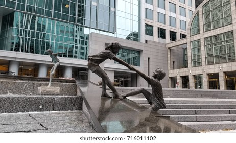 CHARLOTTE NC USA September 10 2017: Children Playing in a Fountain bronze statues in a Charlotte downtown park.

