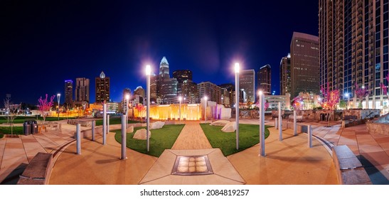 Charlotte, North Carolina, USA uptown skyline and park at night.