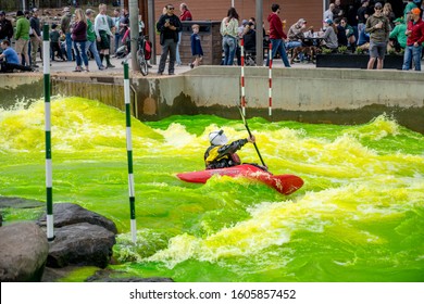 Charlotte, North Carolina/USA - March 16, 2019: The Annual Green River Revival Festival At The U.S. National Whitewater Center Where Every Year They Dye The Water Green To Celebrate St. Patrick's Day.