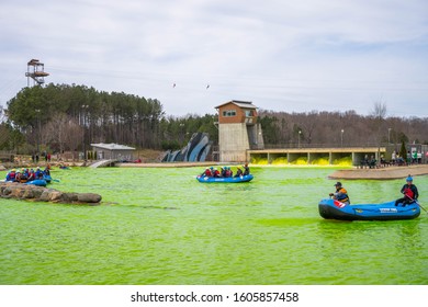 Charlotte, North Carolina/USA - March 16, 2019: The Annual Green River Revival Festival At The U.S. National Whitewater Center Where Every Year They Dye The Water Green To Celebrate St. Patrick's Day.