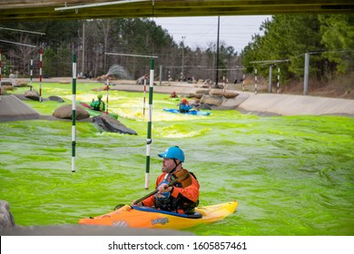 Charlotte, North Carolina/USA - March 16, 2019: The Annual Green River Revival Festival At The U.S. National Whitewater Center Where Every Year They Dye The Water Green To Celebrate St. Patrick's Day.