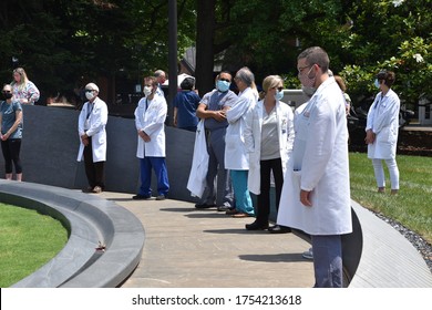 CHARLOTTESVILLE, VA–June 5, 2020,  University of Virginia medical staff at the Memorial for Enslaved Laborers in solidarity with the Black Lives Matter movement.