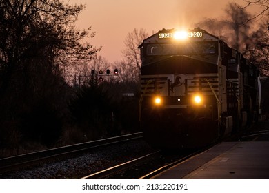 CHARLOTTESVILLE, UNITED STATES - Jan 15, 2022: A Norfolk Southern train passing through the station at Charlottesville just before sunrise