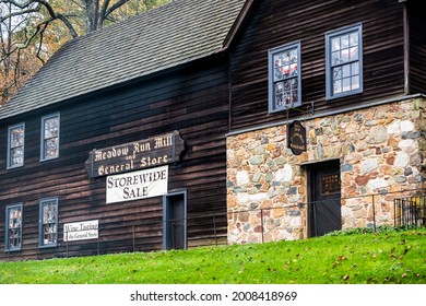 Charlottesville, USA - October 25, 2020: Meadow run mill and general store building architecture with sign for wine tasting and storewide sale by Michie tavern near Thomas Jefferson Monticello estate
