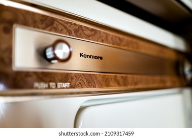 Charlottesville, USA - October 26, 2020: Old Retro Vintage Washer Dryer For Clothes Closeup In Domestic Home Room Cabin Made By Kenmore Company Brand With Button Sign For Push To Start