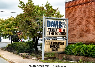 Charlottesville, USA - October 7, 2021: Downtown area in city of Charlottesville University town in rural Virginia with sign by historic house building for Davis TV and Appliance company