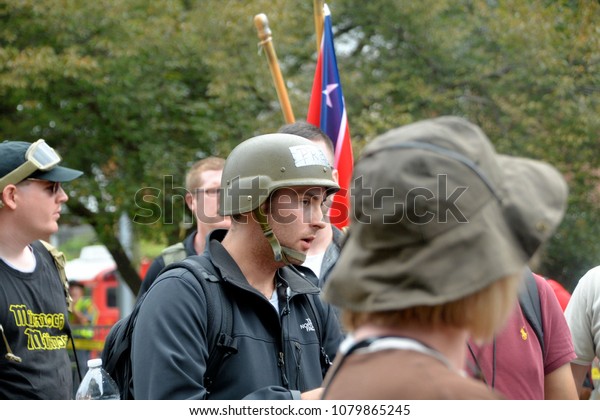 CHARLOTTESVILLE, VA - August 12, 2017: Militia,\
white supremacists and counter-protesters during a white\
nationalist rally that turned violent resulting in one death and\
multiple\
injuries.