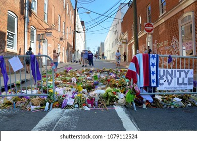CHARLOTTESVILLE, VA - August 2017: Memorial flowers and notes are left at the spot where Heather Heyer was killed and others were injured when a car plowed into a crowd of protesters during a rally.