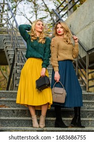 Charm. Stylish Autumn Women Outdoor. Girl Friends Go Upstairs. Fall Season Color Trends. Pleated Trend. Girls In Corrugated Skirt And Sweater. Female Beauty. Knitwear Fashion For Youth.