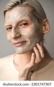 Charming albino model posing for camera while locating in studio