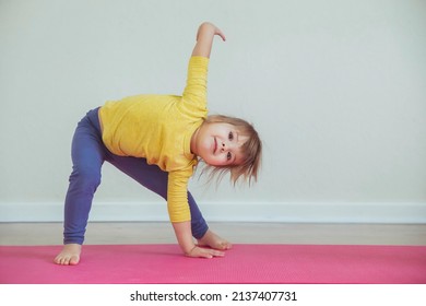 Charming baby doing yoga at home. Place for text - Powered by Shutterstock