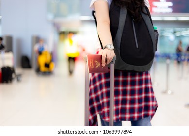 Charming Beautiful Traveler Woman Drag Her Baggage To A Gate At Airport. Attractive Beautiful Girl Comes To Airport So Late And It’s Last Call From Her Flight. She Rushe To Get On Plane, Hold Passport