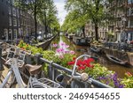 The charming Bloemgracht canal in the Jordaan district of Amsterdam, the Netherlands seen on 27 May 2024 connecting the Prinsengracht with the Lijnbaansgracht.