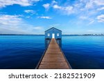 Charming blue boathouse at the end of a pier in Crawley, Western Australia. Built in the 1930s, the tourist popular boatshed is one of the most photographed travel attractions in Perth. 