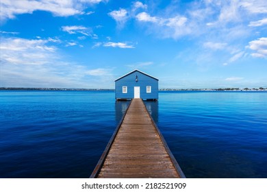 Charming blue boathouse at the end of a pier in Crawley, Western Australia. Built in the 1930s, the tourist popular boatshed is one of the most photographed travel attractions in Perth. 