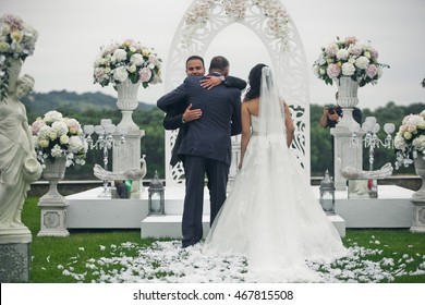 The charming bride with father go on the wedding ceremony - Powered by Shutterstock