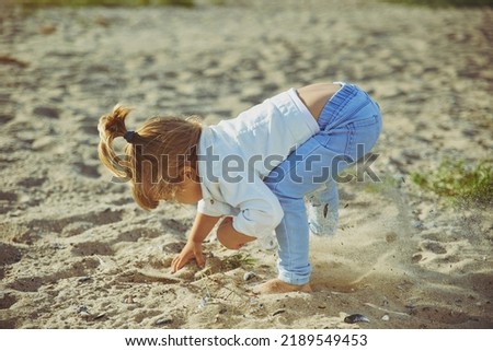 Similar – Foto Bild Baby spielt am Strand.