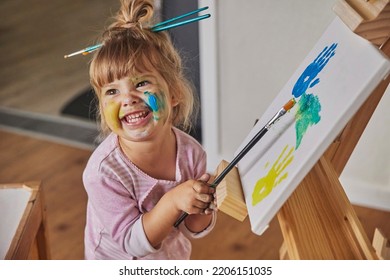 Charming Child Draws And Stains Everything With Paints