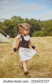 Charming Child In Primitive Clothes At The Viking Festival In Denmark