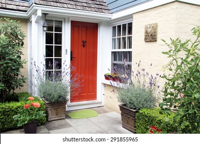 Charming Colorful Front Door Entrance With Blooming Lavender In Containers. 