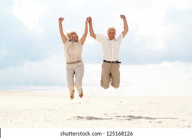 Charming elderly couple went to the beach to enjoy the sea breeze - Powered by Shutterstock