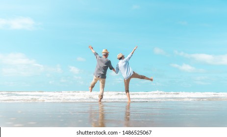 Charming elderly couple went to the beach to enjoy the sea breeze - Powered by Shutterstock