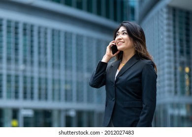 Charming And Elegant Japanese Woman Engaged In A Phone Call, Concept Of Success In Business, Ransom And Successful Entrepreneurship Of Women