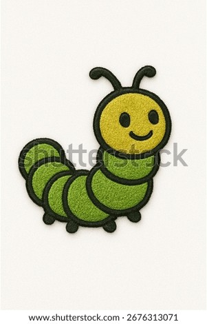 A charming, embroidered patch in the shape of a caterpillar. The design features a yellow head with a happy face and a segmented green body, all outlined with a thick, dark border.