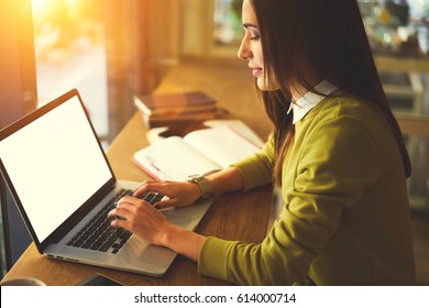 Charming Female Blogger Uploading Multimedia Files On Web Page Chatting With Followers Via Laptop Computer With Mock Up Screen, Talented Student Of Journalist Doing Homework Keyboarding Article Text