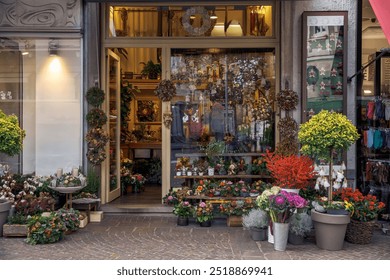 Charming flower shop with vibrant floral arrangements outside, an inviting entrance, colorful plants on display, storefront showcase of florist business - Powered by Shutterstock