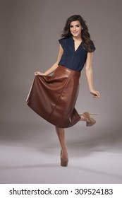 Charming Girl In Elegant Leather Skirt