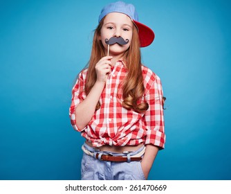 Charming Girl Holding Moustache On A Stick, Like She Is Man