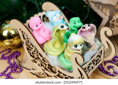 Charming Handmade Snowman and Snake Soap Figures in Rustic Wooden Sled: A Whimsical Winter Scene That Captures the Joy of the Season, Perfect Holiday Decor and Unique Gifting Ideas. - Powered by Shutterstock