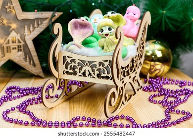 Charming Handmade Snowman and Snake Soap Figures in Rustic Wooden Sled: A Whimsical Winter Scene That Captures the Joy of the Season, Perfect for Holiday Decor and Unique Gifting Ideas. - Powered by Shutterstock