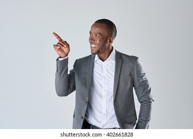 Charming Handsome Young Black Business Man Pointing His Hand Up To Show Present Sell Product