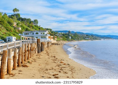 Charming homes nestled along the picturesque coastline of Malibu in California. - Shutterstock ID 2311795829