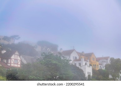 Charming Houses On A Hill In San Francisco California On A Peaceful Foggy Day. Exterior View Of Homes On A Quiet Neighborhood With Sky Background In The Early Morning.