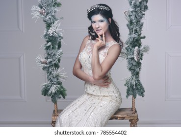 Charming Ice Maiden Sitting On Swing 