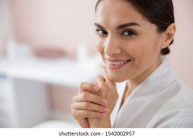 Charming joyful woman touching her hand stock photo. Website banner - Shutterstock ID 1542002957
