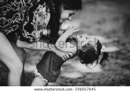 Similar – Image, Stock Photo scared boy hiding in his mom’s dress