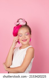 Charming Little Girl With Pink Hairstyle And Pink Makeup. Tween Young Model Posing On Pink Background.