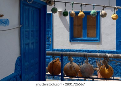 Charming maritime architecture showcasing rustic coastal decorations and fishing floats, ideal for holiday travel, tourism and lifestyle concepts.