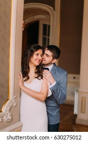 Charming Newlywed Pair Embracing In Vintage Victorian Mansion Interior