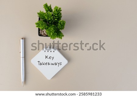 A charming note of Key Takeaways accompanied by a pen on a desk, creating a warm and inviting setup for creative projects.