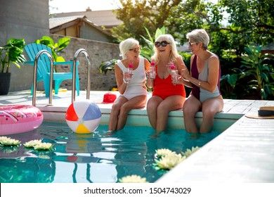 Charming Old Ladies In Swimsuits Chatting At Laughing Outdoors Stock Photo