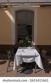 A Charming Outdoor Dining Setup Featuring an Elegant Table and Inviting Ambiance