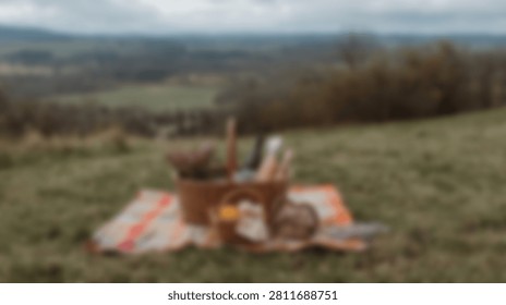 A charming picnic setup featuring a wicker basket overflowing with food and beverages, placed on a colorful blanket in a serene natural landscape.
