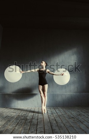 Similar – Rear view portrait of one young middle age athletic woman at crossfit training, exercising with trx suspension fitness straps over dark background